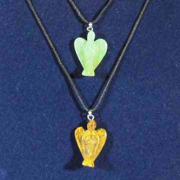 two carved crystal angel pendants hanging on leather neck cords