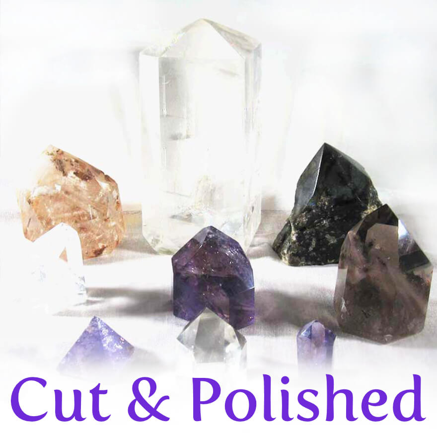 A selection of polished crystal points, including amethyst, citrine, quartz and smoky quartz points