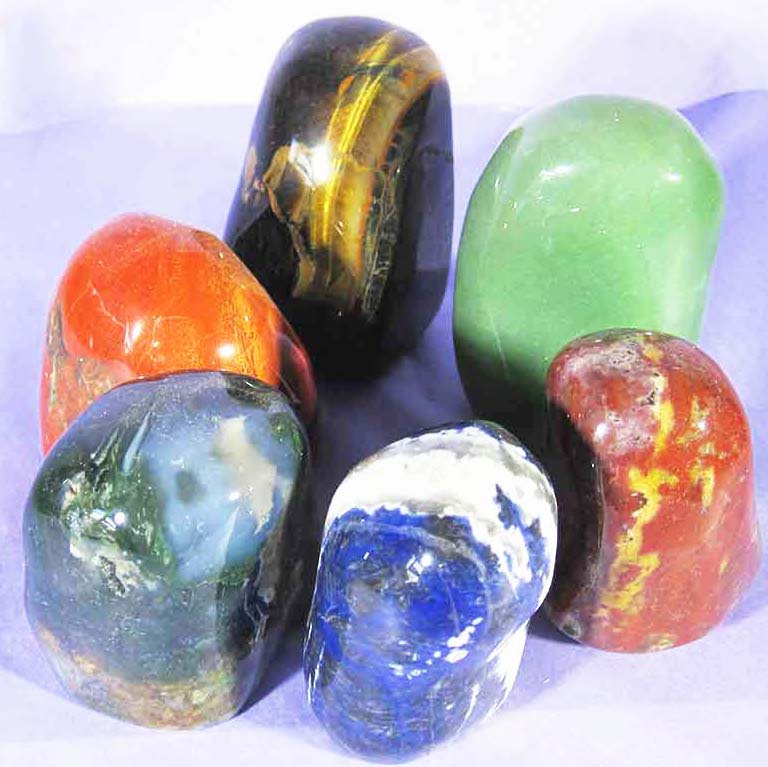 6 different carved crystal chunks: agate, sodalite, carnelian, aventurine and tigers eye