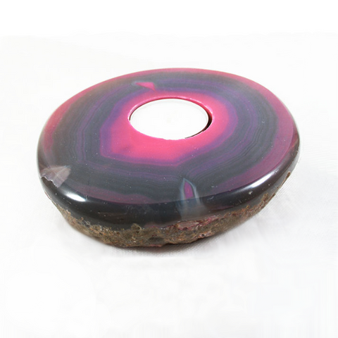 a smooth circular agate tealight holder in a deep red colour